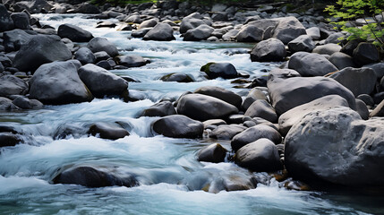A mountain river flowing over smooth rocks.