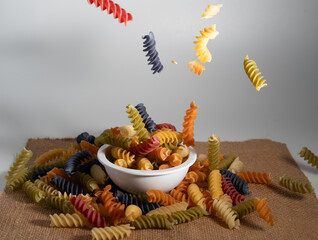 levitaite spiral multicolor spaghetti on bowl and sackcloth