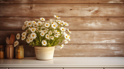 Fototapeta na wymiar A rustic kitchen with a wooden plank accent wall displaying farmhouse artwork and a bouquet of daisies on the counter.