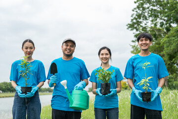 Volunteering Protection of environment and nature ecology concept. Group of volunteer plant a tree...