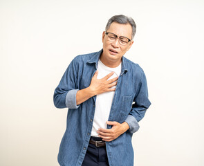 Old man senior he felt a pain in his chest held his hand and squeezed it. Mature Heart attack that...