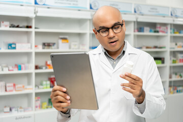 Professional Pharmacist man in uniform holding medicine bottle talks to patient via online video...