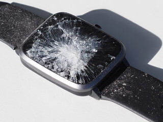 Smart watch with cracked screen. Close-up.