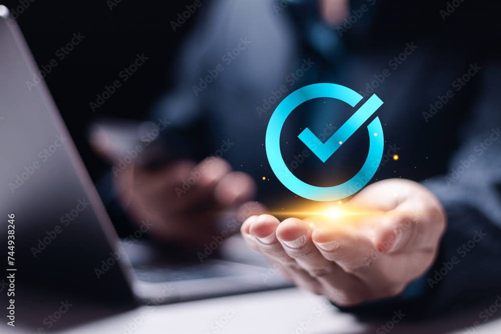 Poster document management concept. businessman use laptop and hand holding correct sign and tick correct m