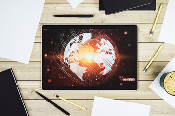 Abstract creative world map on modern digital tablet monitor, tourism and traveling concept. Top view. 3D Rendering