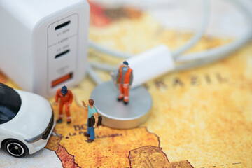 Miniature Figures and Electric Car Charging Station.