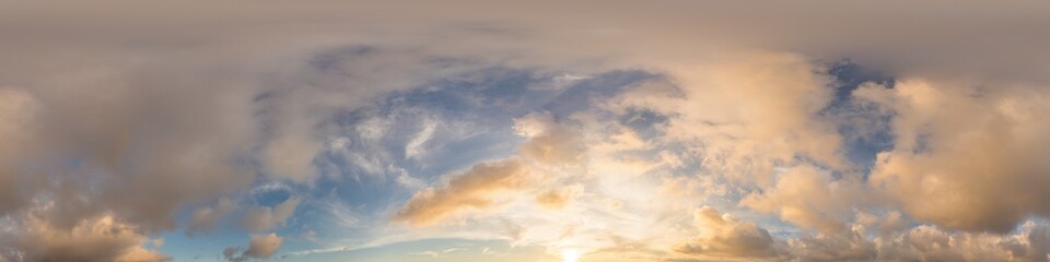 Dark blue sunset sky with glowing golden Cumulus clouds in seamless panorama. HDR 360 spherical...