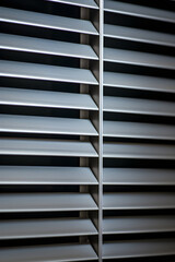 Close-up Detailed View of a Modern, Metallic HVAC Vent Installed in Wall