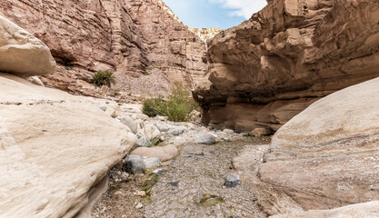 Narrow channel for stream in gorge Wadi Al Ghuwayr or An Nakhil and the wadi Al Dathneh near Amman in Jordan