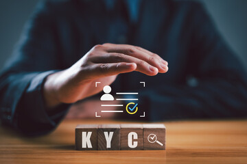 KYC on wooden cubes. know your customer with magnifying glass and customer information. Business...