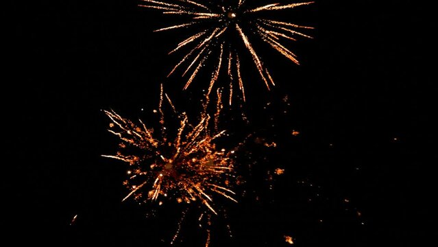 Shining fireworks at night sky. 4k video footage UHD 3840x2160 