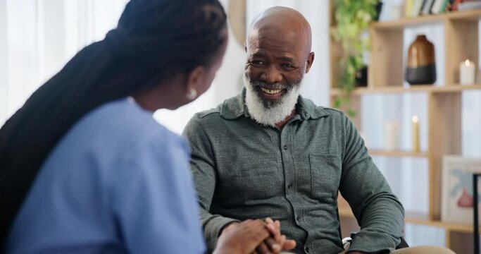 Conversation, nurse and senior man in living room of nursing home for medical consultation. Discussion, healthcare and caregiver talking to African elderly male patient in retirement at house.