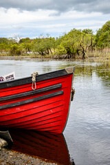 Moored boats on river in Killarney National Park, Ireland. High quality photo