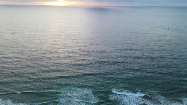 Aerial drone pullback reverse view of Cronulla in the Sutherland Shire, South Sydney, NSW Australia during an early morning sunrise in February 2024   