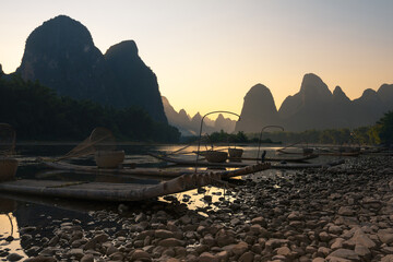 Karst mountains and Li River with bamboo rafts moored on the river