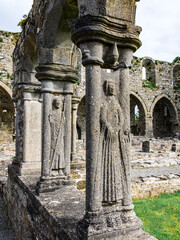 Jerpoint Abbey tipperary Ireland ancient cloister sculptures unique depicting saints and ornamentation, irregular, worn, and decayed, but restored 