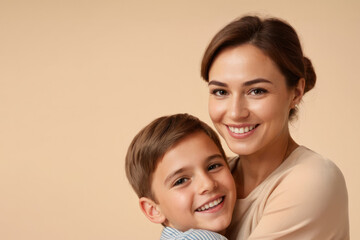 happy woman hug her son on beige background with copy space. Concept of Mothers day