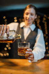 Barman pouring whiskey whiskey glass beautiful night