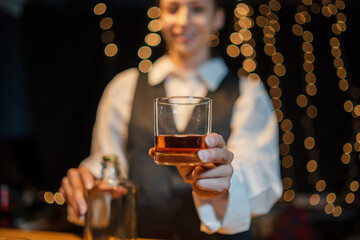 Barman pouring whiskey whiskey glass beautiful night