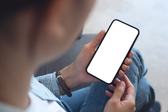 Mockup, Woman's Hands Holding Mobile Phone With Blank Screen In Coffee Shop, Over Shoulder View