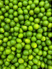 A bunch of green lemons