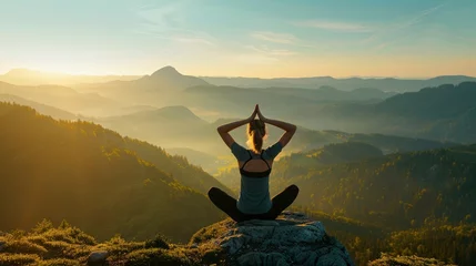Fotobehang starting your day with a yoga session as the sun rises over a mountain range. The air is crisp, and the only sounds are the chirping of birds and the rustling of leaves, © Shani work