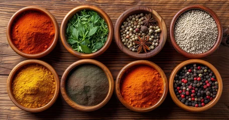 Fotobehang A Rich Assortment of Global Spices Presented in Bowls on a Textured Wooden Counter © lander