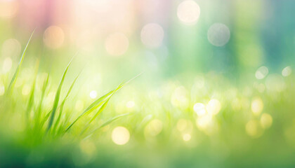 Obraz premium Close-up of fresh green grass with dew on a blurred bokeh lights background