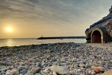 Calima sunset on the rocky beach of Gran Canaria,  - obrazy, fototapety, plakaty