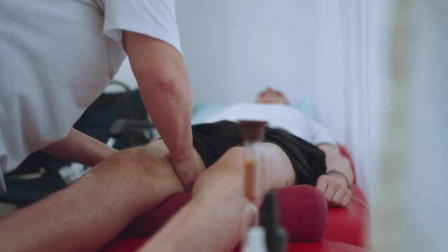 Therapeutic foot massage, foot massage, massage therapist massages feet, medical massage