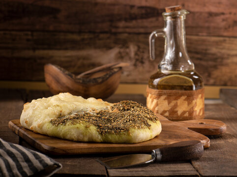 Zaatar manakish is an arabic flatbread with cheese, herbs and olive oil