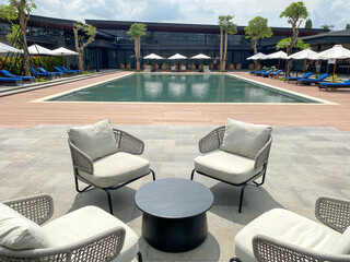 Swimming pool at a club house in Indonesia. Lovely swimming pool with cloudy blue sky.