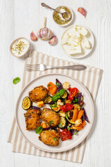 baked chicken thighs with veggies, olives, feta