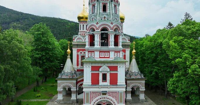 Bulgaria, Shipka Memorial Russian Church (Monastery Nativity) and panoramic view of town Shipka, Stara Zagora Region, scenic aerial video