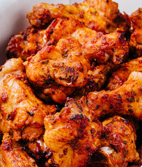 Fried chicken wings and legs in a paper box