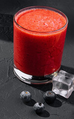 Strawberry smoothie on stone