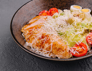 Caesar salad with lettuce, chicken, avocado and croutons