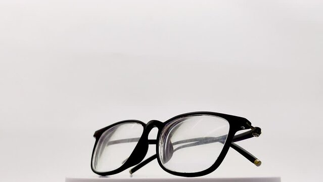spinning men's glasses isolated on white background