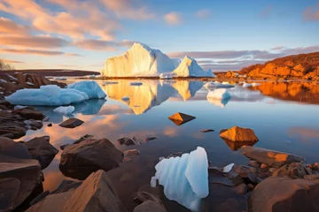 Fototapeten Melting glaciers. large iceberg on shore on clear day, climate change and global warming concept © polack