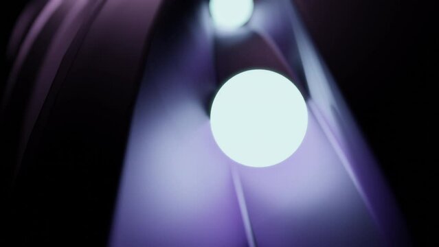 Glowing 3d balls moving on surface. Design. Neon balls roll along 3D track. Glowing balls roll along path of maze path