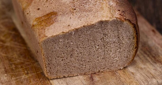 rectangular fresh and soft bread on the table, a loaf of wheat and rye flour bread on the table