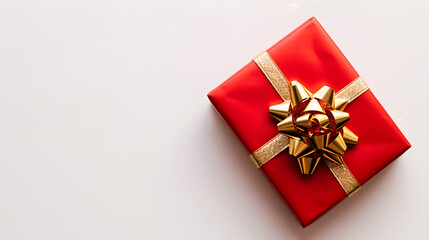 red gift box Tie a golden bow on a white background,top view