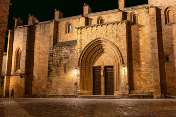 Medieval stone church at night in the monumental city of Caceres.