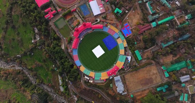 An aerial view from a top angle captures the beauty of the cricket stadium nestled in Dharamshala, Himachal Pradesh.