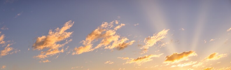 Panorama of orange sunset sky cloudy view with bright sun. Relaxing endless heaven dreamy positive energy template. Looking up freedom summer sunrise sky. Beautiful colorful sky background
