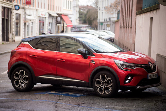 Mulhouse - France - 25 february 2024 - Profile view of red Renault captur  parked in the street 