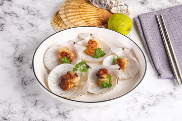Grilled scallops shell with butter