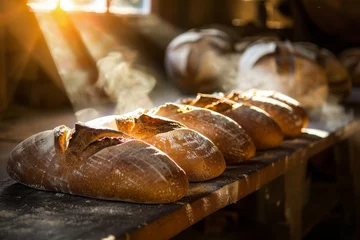 Papier Peint photo Pain Artisan bread loaves with a golden crust, fresh from the oven, basking in warm sunlight  
