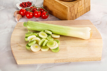 Ripe sliced leek over board