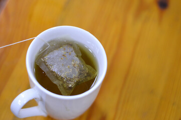 Anise hot drink, with so many healthy benefits, anise packet in a boiled hot water to prepare the drink, Aniseed Pimpinella anisum is a flowering plant in the family Apiaceae, selective focus